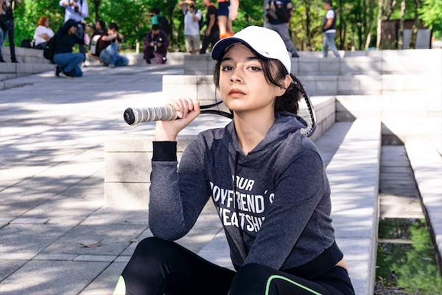 Woman rocking a white organic cotton cap