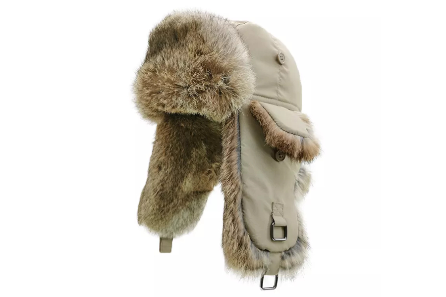 A beige colored trapper hat with fur lining inside