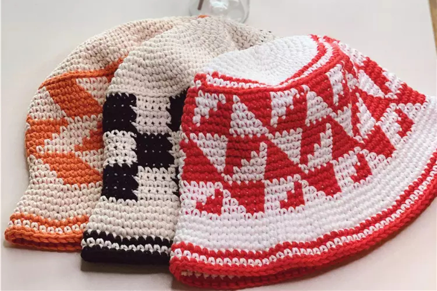 Three different colored crochet winter hats with patterns